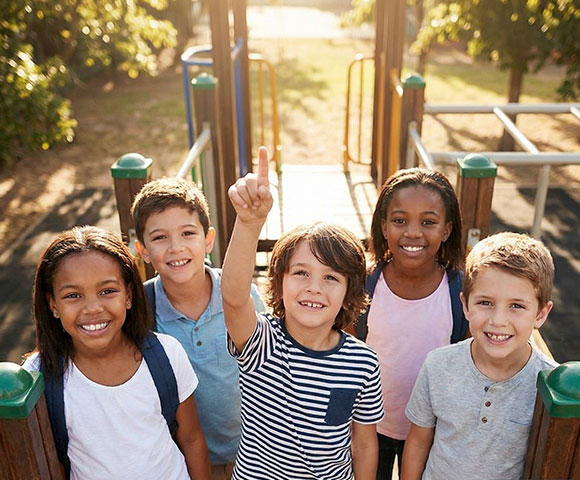 School-age children enjoying after-school activities at Amores Daycare